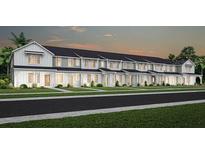 Charming new townhomes feature modern farmhouse architecture and professionally landscaped yards at 2692 Clear Night Ave, Kissimmee, FL 34744