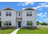 Charming two-story home with modern design and well-manicured lawn at 5625 Brosnan Rd, St Cloud, FL 34771