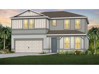 Charming two-story home with a well-maintained lawn, neutral tones, and attached two car garage at 6005 Blue View Way, St Cloud, FL 34771