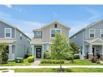 Charming two-story home with a manicured front yard and inviting curb appeal, in a well maintained neighborhood at 11288 Listening Dr, Orlando, FL 32832