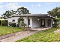 Charming single-story home featuring a covered carport and inviting front yard landscaping at 137 W Lauren Ct, Fern Park, FL 32730