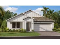 Charming new construction home with a two-car garage, modern farmhouse accents, and tidy front lawn at 2895 Haze Rd, Clermont, FL 34714