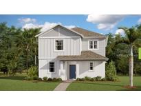 Charming two-story home featuring board and batten siding, complemented by lush landscaping and a well-manicured lawn at 3021 Namaste Dr, Clermont, FL 34714