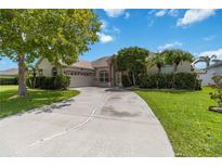 Charming single-story home with a well-manicured lawn and inviting driveway at 3250 Sawgrass Creek Cir, St Cloud, FL 34772
