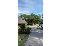 Wide view of a parking area and partial view of a building exterior at 1022 Love Ln # 35, Apopka, FL 32703