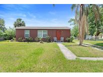Charming single-story home with a well-maintained lawn and inviting front porch area at 3824 Johnson St, Orlando, FL 32805