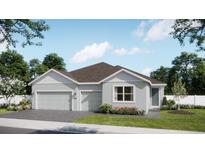 Charming single-story home with a two-car garage, grey exterior, and well-manicured lawn at 737 Fairfields Ln, Deland, FL 32720