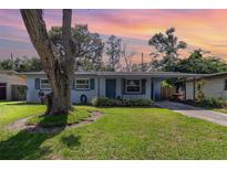 Charming single-story home featuring a well-maintained lawn, mature tree, and inviting curb appeal at 436 Azores Ave, Orlando, FL 32811