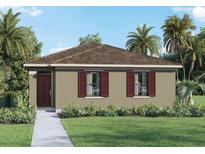 Charming single-story home with a well-manicured lawn and lush tropical landscaping at 5608 Paddock Fence Ln, Apopka, FL 32712