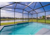 Screened pool with beautiful lake view, perfect for relaxing and entertaining in your private backyard oasis at 3943 Crawley Down Loop, Sanford, FL 32773