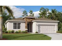 Charming single-story home featuring a stone accent wall and a well-manicured lawn surrounded by mature trees at 4741 Katrina Dr, Haines City, FL 33844
