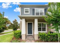 Charming two-story home with well-maintained landscaping, covered porch, and neutral color palette at 11054 Hanlon Terrace Aly, Winter Garden, FL 34787