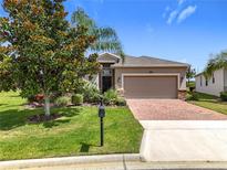 Charming home with well-maintained lawn, mature tree and brick-paved driveway at 3744 Quaint Ln, Clermont, FL 34711
