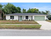 Charming single story home with fresh exterior paint, well manicured front yard and delightful curb appeal at 4858 Brenda Dr, Orlando, FL 32812