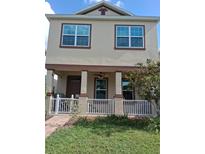 Charming two-story home with a welcoming front porch and well-maintained landscaping at 4900 Beach Blvd, Orlando, FL 32803
