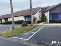 Condominium exterior featuring front parking and landscaping at 101 Grand Plaza Dr # P40, Orange City, FL 32763