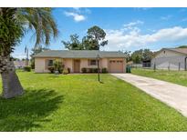 Charming single-story home featuring a well-manicured lawn and inviting curb appeal at 1591 Pendleton St, Deltona, FL 32725