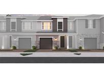 Charming townhome featuring a brick and siding facade, garage, and well-manicured landscaping at 1689 Greenleaf Woods Cv, Oviedo, FL 32765