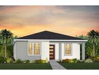 Charming single-story home featuring a modern front door, neutral colors, and tropical landscaping at 7125 Rosy Sky Ave, Orlando, FL 32829