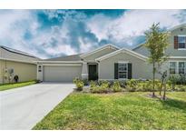 Charming single-Gathering home featuring a well-maintained lawn and inviting curb appeal at 798 Kapi Dr, Groveland, FL 34736