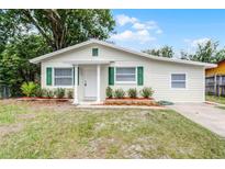 Charming single-story home with well-manicured lawn, updated siding and green shutters at 1502 S Summerlin Ave, Sanford, FL 32771