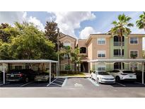 Condo complex with assigned covered parking and easy access to the units and close to the beach at 4833 Cypress Woods Dr # 4205, Orlando, FL 32811