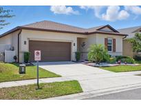 Charming single-story home with well-maintained landscaping and a two-car garage at 914 Fallon Hills Dr, Haines City, FL 33844