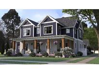 Charming two-story home with a welcoming porch and beautiful landscaping at 1207 Ridge Lake Way, Oakland, FL 34787