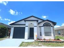 Charming single-story home features a well-maintained exterior and manicured lawn at 2524 Daffadil Ter, Sanford, FL 32771