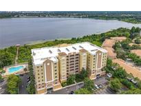 Stunning lakefront condo building with a swimming pool and parking at 6336 Buford St # 207, Orlando, FL 32835