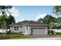 Charming single-story home featuring a two-car garage and a well-manicured front yard at 705 Fairfields Ln, Deland, FL 32720