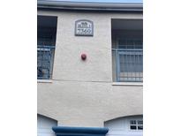 Building exterior featuring building number 7360 and small blue balconies at 7360 Westpointe Blvd # 114, Orlando, FL 32835