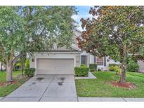 Charming two-story home featuring a spacious two-car garage and well-maintained landscaping at 1067 Chatham Break St, Orlando, FL 32828