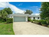 Charming single-story home with a two-car garage, brick facade, and well-manicured landscaping at 111 Woodstream Ct Ct, Maitland, FL 32751