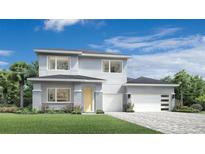 Modern two-story home with a three car garage, lovely landscaping and contemporary design at 1880 Stonecliff Dr, Apopka, FL 32703