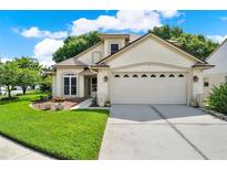 Charming home featuring a well-manicured lawn, and a convenient two-car garage at 3561 Ventura Club Cir, Orlando, FL 32822