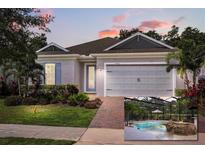 Beautiful one-story home with manicured lawn and screened pool overlooking lush golf course at 7778 Four Seasons Blvd, Kissimmee, FL 34747