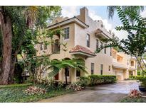 Stunning two-story home featuring lush landscaping and a Spanish-style terracotta tile roof at 820 Ellwood Ave # A, Orlando, FL 32804