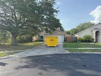 Charming single-Gathering home featuring a two-car garage and traditional architectural details at 1133 Olympic Ct, Apopka, FL 32712