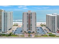 Stunning high-rise condo building with ocean views, manicured landscaping, and convenient parking at 2947 S Atlantic Ave # 601, Daytona Beach, FL 32118