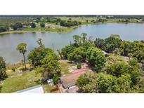 Expansive waterfront property with mature trees and plenty of privacy on a large lake at 2990 E Central Ave, Bartow, FL 33830