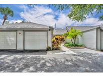 Charming villa featuring a well-maintained exterior and two-car garage at 463 Warrenton Rd # 463, Winter Park, FL 32792