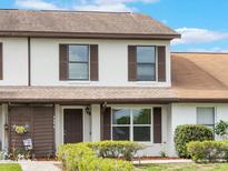 Charming two-story townhouse with a well-maintained front yard and inviting entrance at 9494 Lake Lotta Cir, Gotha, FL 34734