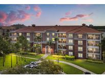 Well-maintained building showcasing a charming facade and lush landscaping at 5012 Shoreway Loop # 10107, Orlando, FL 32819