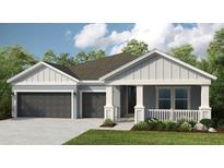 Charming single-story home with a two-car garage, covered porch, and well-maintained lawn at 854 Junonia Blvd, New Smyrna Beach, FL 32168