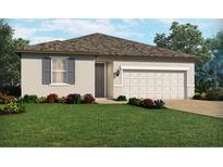 Charming single-story home features a well-manicured lawn, beautiful landscaping, and a two-car garage at 3132 Legends Preserve Dr, Daytona Beach, FL 32124