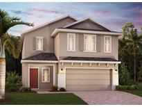 Charming two-story home featuring a two-car garage, landscaped lawn, and a welcoming red front door at 14467 Crestavista Ave, Clermont, FL 34714