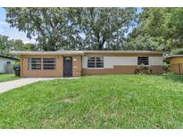 Charming single-story home features a well-maintained lawn and a cozy, inviting exterior at 1711 37Th St, Orlando, FL 32839