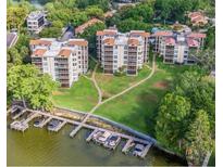 Aerial view of multi-story condo buildings with boat docks on the water at 204 Quayside Cir # 601, Maitland, FL 32751