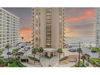 A high-rise condo on the beach with sunset skies, offering ocean views and parking at 3023 S Atlantic Ave # 2050, Daytona Beach, FL 32118